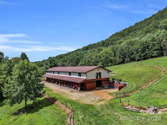 exterior space with a lawn and a rural view