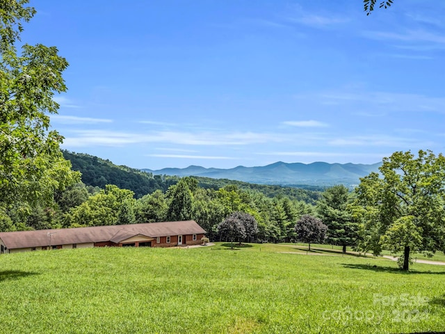 mountain view featuring a rural view