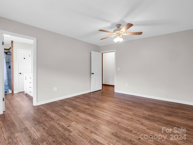 unfurnished room with ceiling fan and hardwood / wood-style flooring