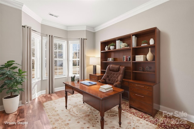 home office featuring light hardwood / wood-style flooring and ornamental molding