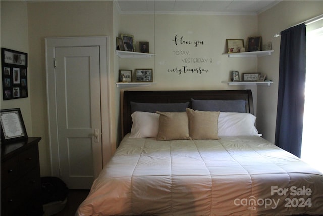 bedroom with crown molding