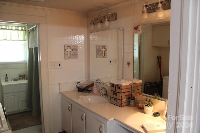 bathroom with vanity, tile walls, and ornamental molding