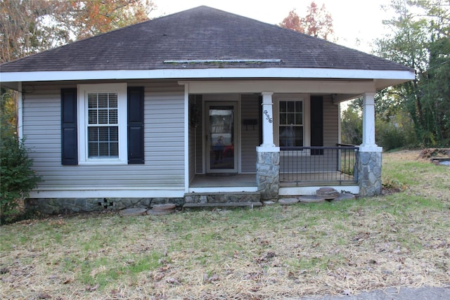 view of front of house featuring a front yard and a porch