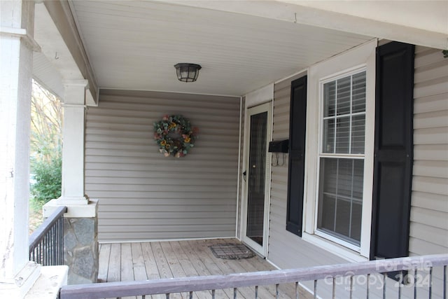 view of exterior entry featuring a porch