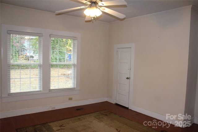 spare room featuring crown molding, ceiling fan, and dark hardwood / wood-style flooring