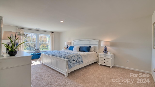 bedroom with light colored carpet