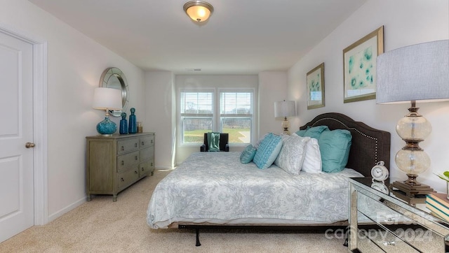 bedroom with light carpet