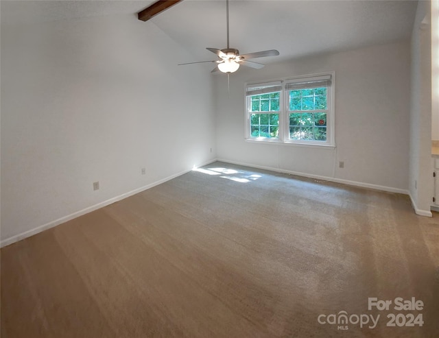 spare room with ceiling fan, lofted ceiling with beams, and light wood-type flooring