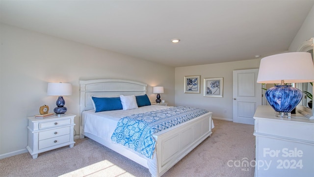 bedroom with light colored carpet