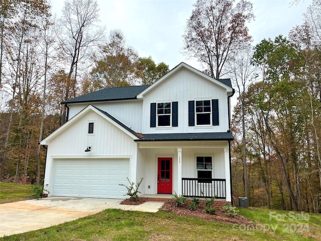 view of front of house with a porch and a garage