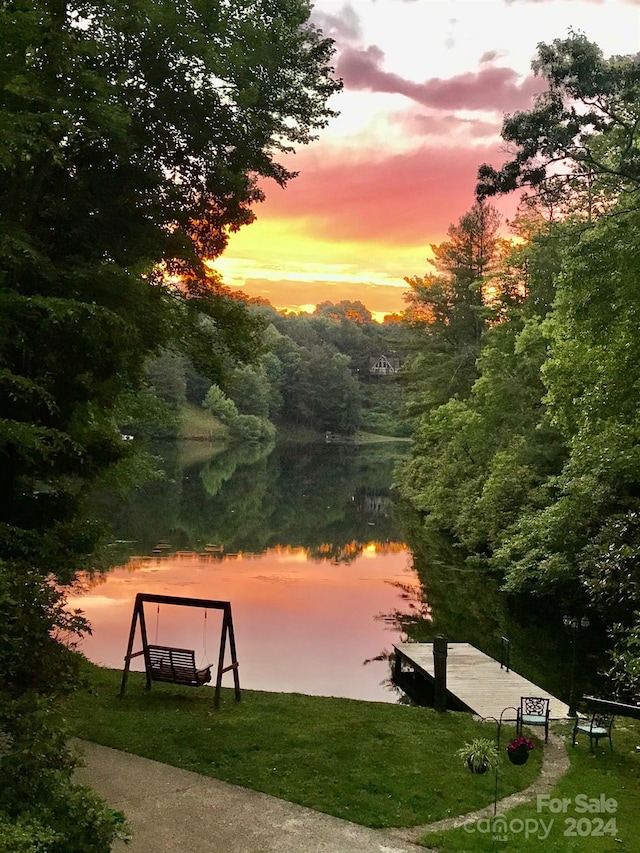 view of community with a water view