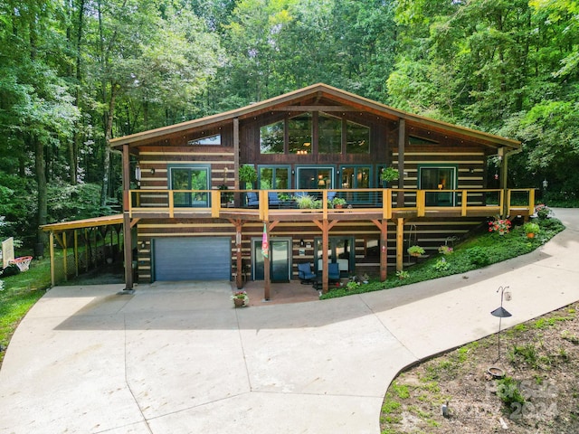 log home featuring a garage