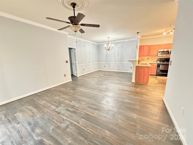 unfurnished living room with ornamental molding, baseboards, and light wood finished floors