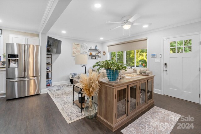 living room with ceiling fan, dark hardwood / wood-style floors, and ornamental molding