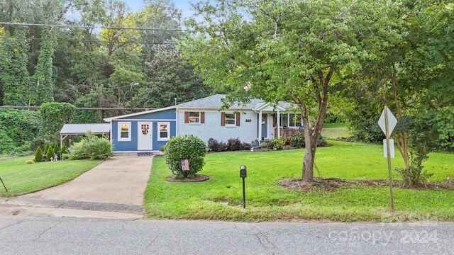 ranch-style house with a front lawn