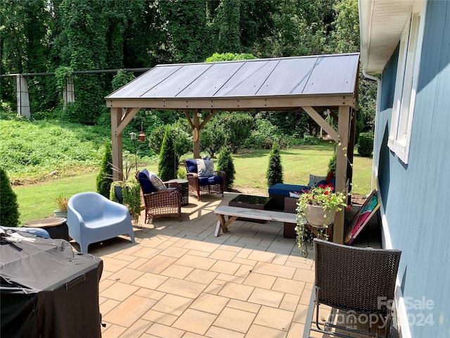 view of patio / terrace with outdoor lounge area and a gazebo