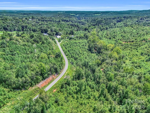 aerial view featuring a forest view