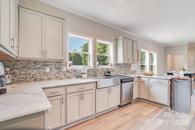 kitchen with light stone counters, a sink, ornamental molding, dishwasher, and tasteful backsplash