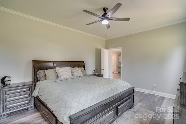 bedroom featuring crown molding, ceiling fan, wood finished floors, and baseboards