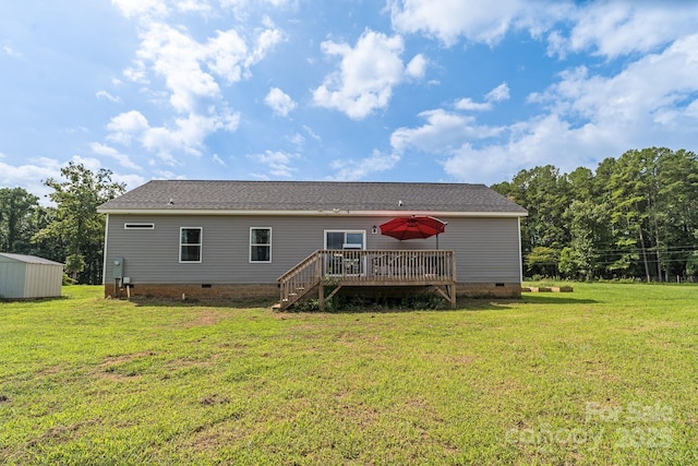 rear view of property with crawl space, stairs, a deck, and a lawn