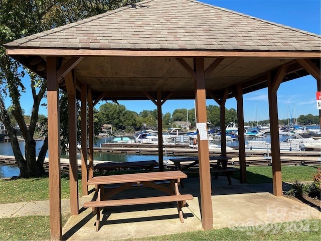 surrounding community featuring a gazebo and a water view