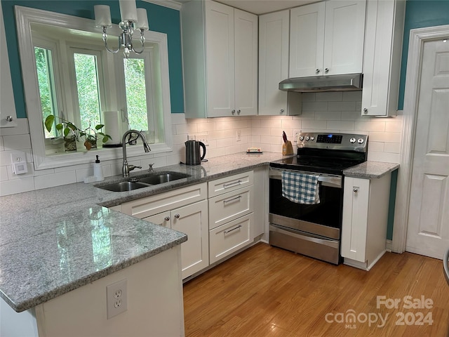 kitchen featuring stainless steel electric stove, light hardwood / wood-style flooring, sink, white cabinetry, and light stone counters