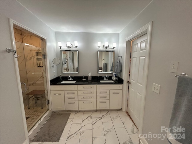 bathroom with vanity and an enclosed shower