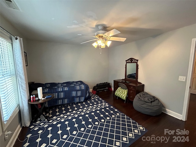 living area featuring ceiling fan and wood-type flooring