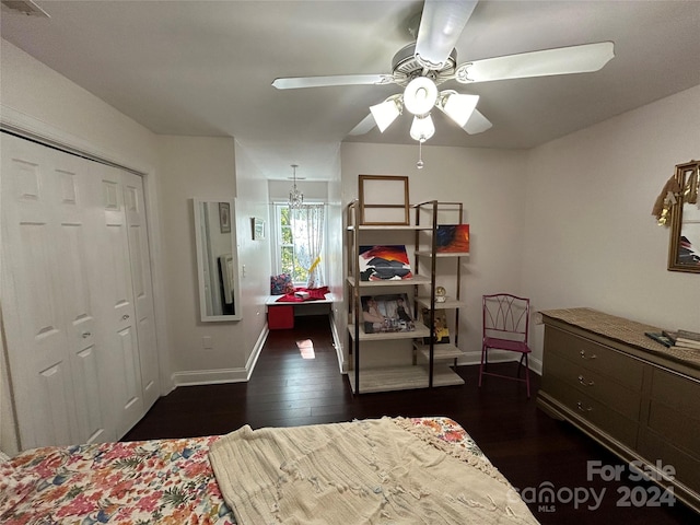 bedroom with dark hardwood / wood-style floors, ceiling fan, and a closet