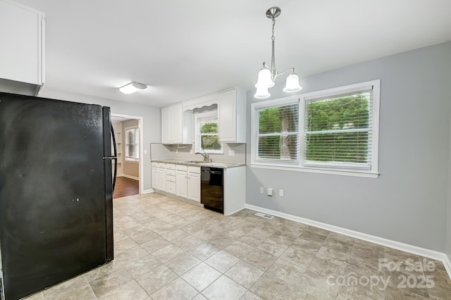 kitchen featuring an inviting chandelier, sink, black appliances, white cabinets, and hanging light fixtures