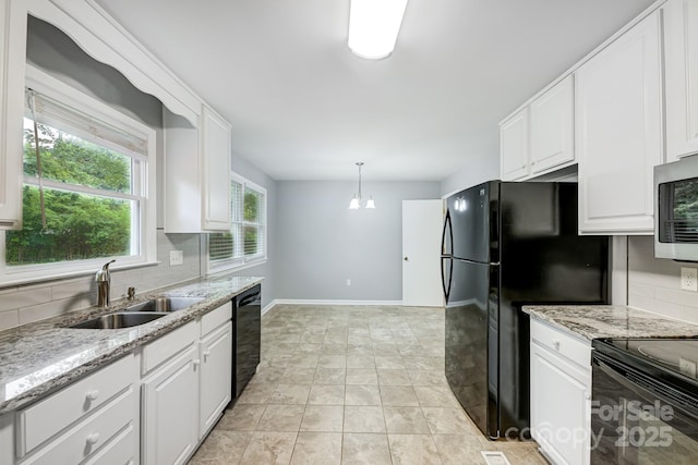 kitchen featuring black appliances, decorative light fixtures, decorative backsplash, sink, and white cabinetry