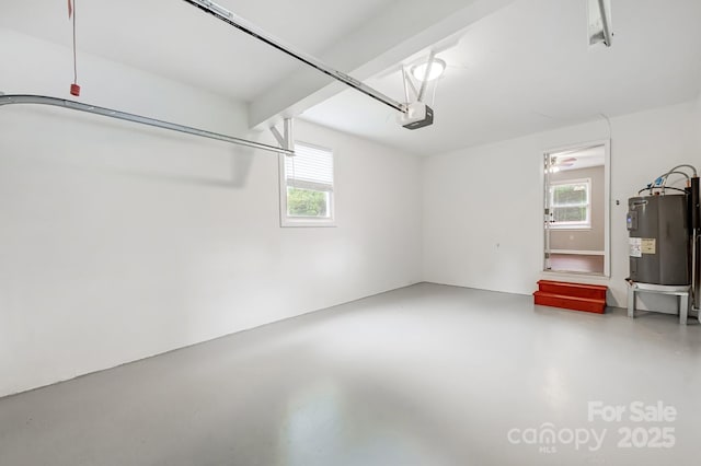 garage featuring electric water heater and a garage door opener