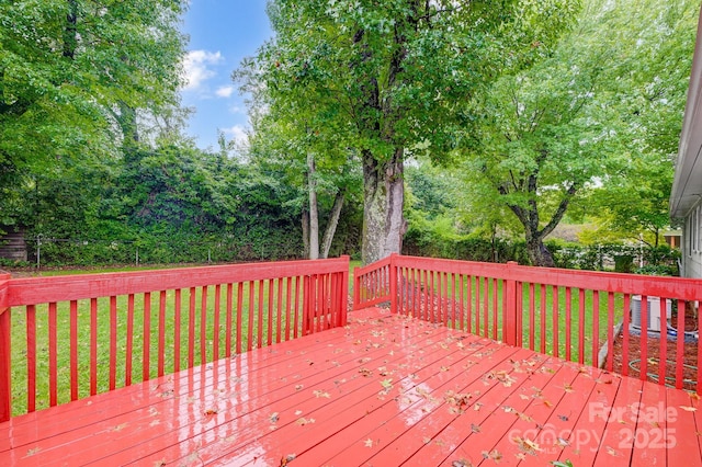 deck with central AC and a lawn