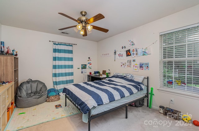 carpeted bedroom featuring ceiling fan