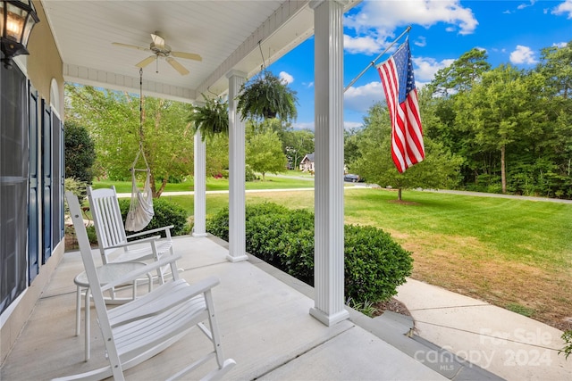 view of patio with a ceiling fan and a porch