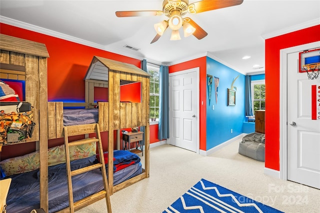 bedroom with carpet flooring, ceiling fan, and ornamental molding