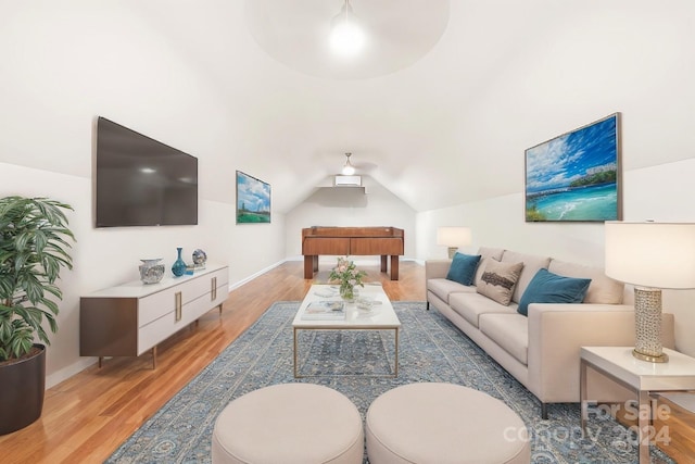 living room with hardwood / wood-style flooring and lofted ceiling