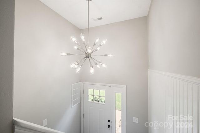 foyer with a notable chandelier