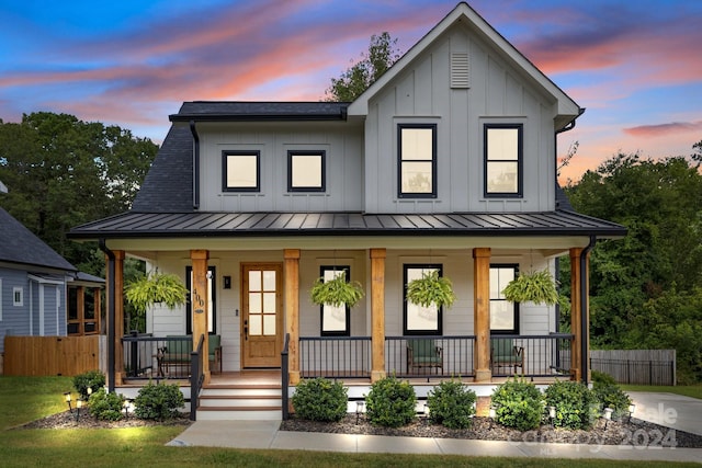 modern farmhouse style home with covered porch