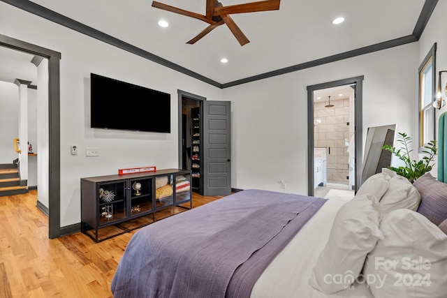 bedroom with recessed lighting, crown molding, baseboards, and wood finished floors