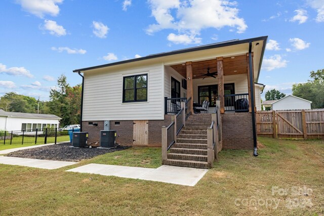 view of front of property featuring central AC, ceiling fan, stairway, and fence