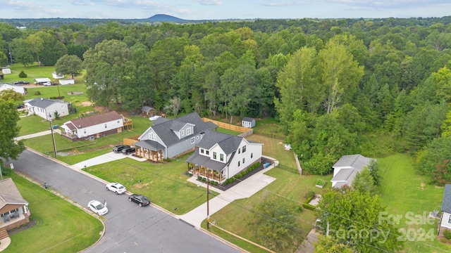 bird's eye view featuring a residential view and a view of trees