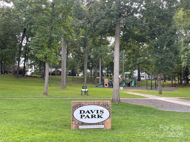 surrounding community featuring playground community and a yard