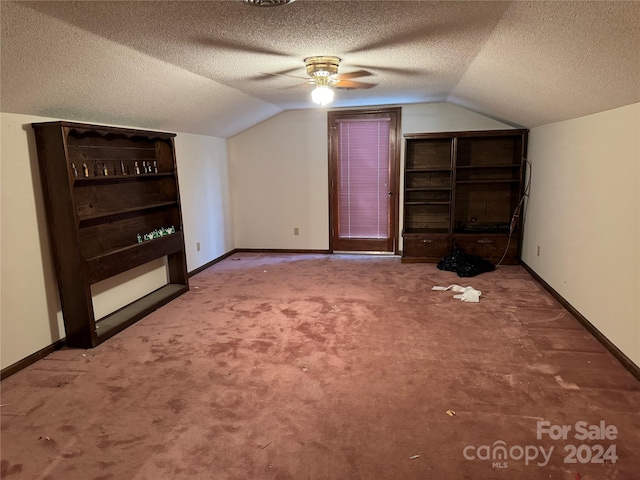4539 S New Hope Rd, Gastonia, NC 28056 - bonus room featuring baseboards, lofted ceiling, a textured ceiling, and carpet flooring