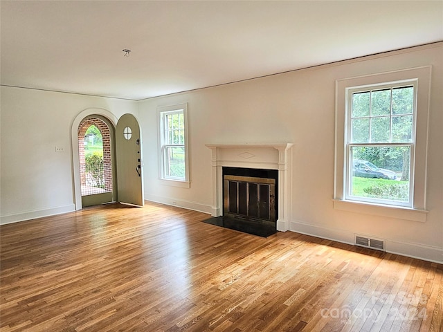 unfurnished living room with light hardwood / wood-style floors