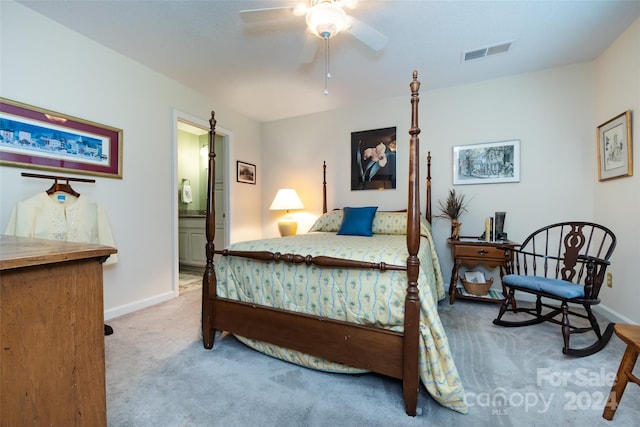 bedroom with ensuite bath, ceiling fan, and carpet floors