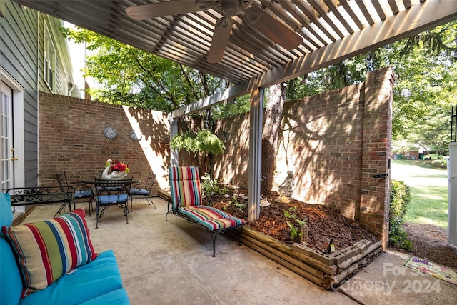 view of patio / terrace featuring ceiling fan and a pergola