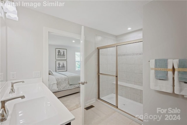 bathroom featuring vanity and a shower with door