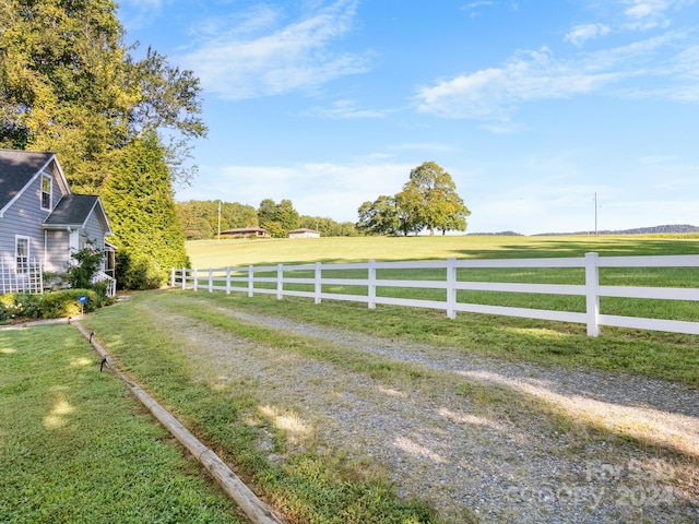 view of yard with a rural view