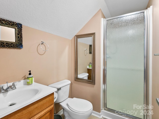 bathroom with a shower with shower door, a textured ceiling, vanity, toilet, and lofted ceiling